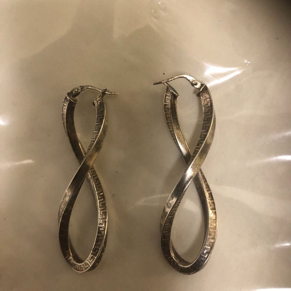 Silver  earrings with twists. Long and beautiful !